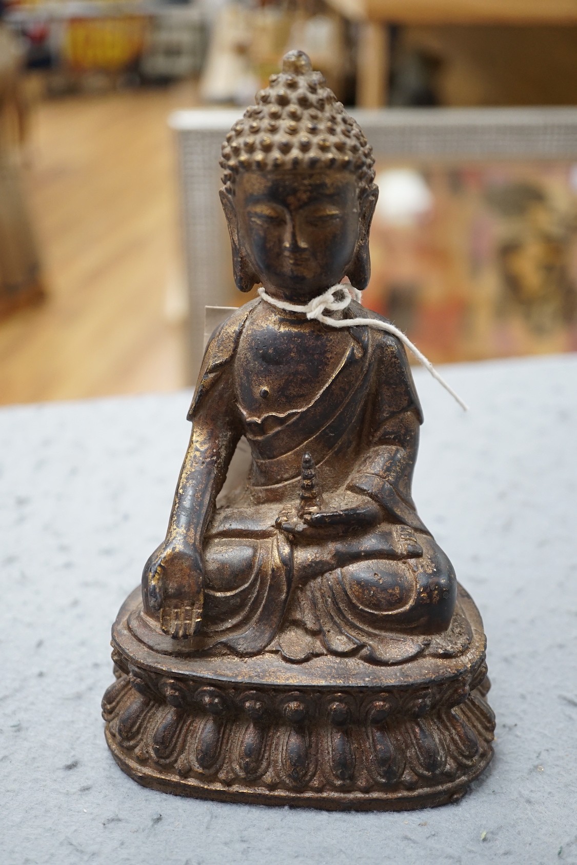 A Chinese gilt iron seated figure of Buddha, 19cm